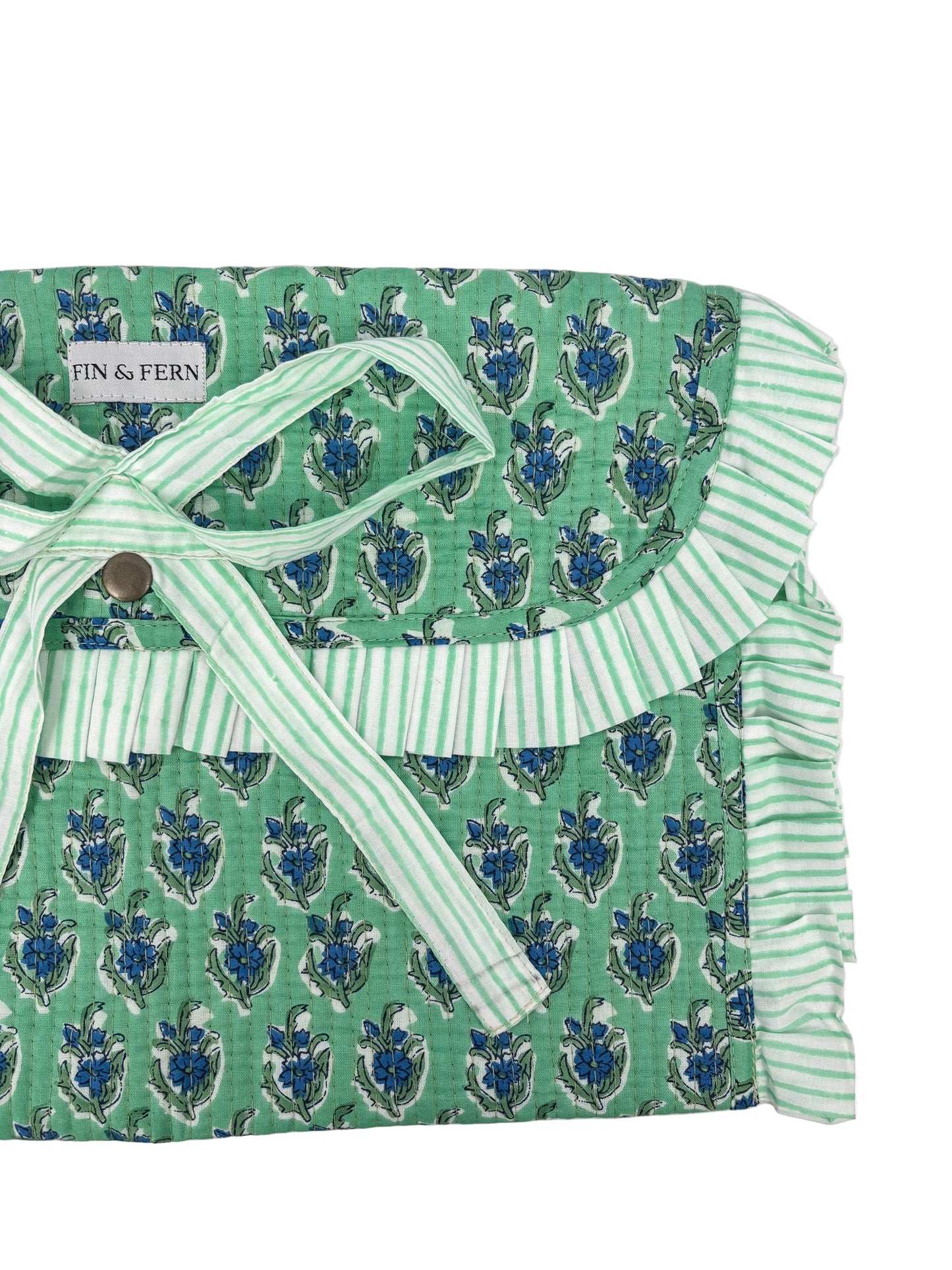 Green patterned fabric with white trim and a button, branded 'Finn & Fern'.