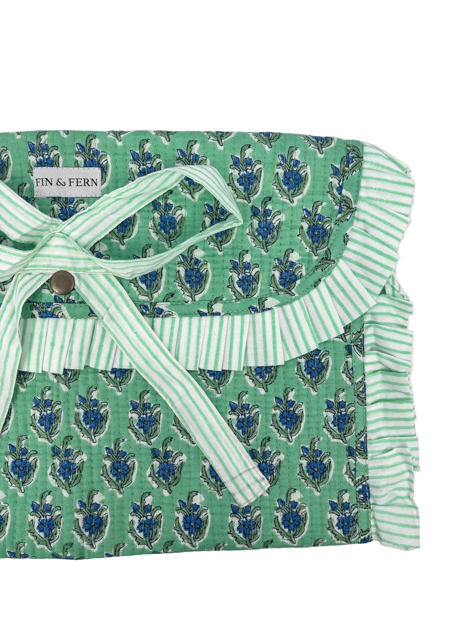 Green patterned fabric with white trim and a button, branded 'Finn & Fern'.